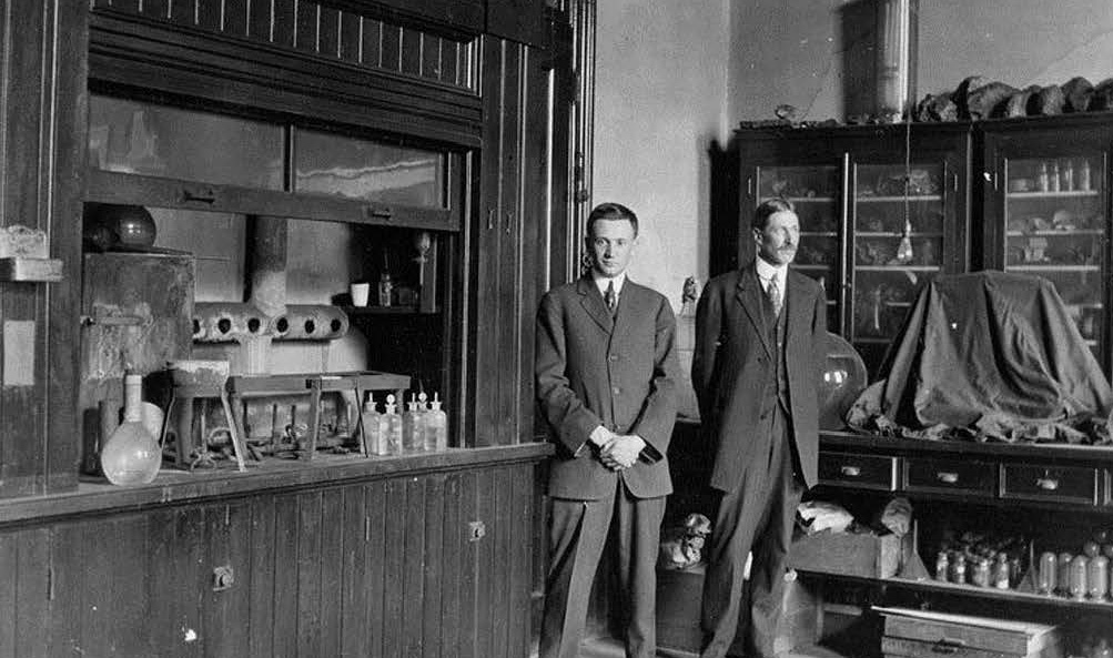 E.S. Freed and Charles O. Hill are pictured in a laboratory in Science Hall. The photo is in black and white and was taken between 1913 and 1915.