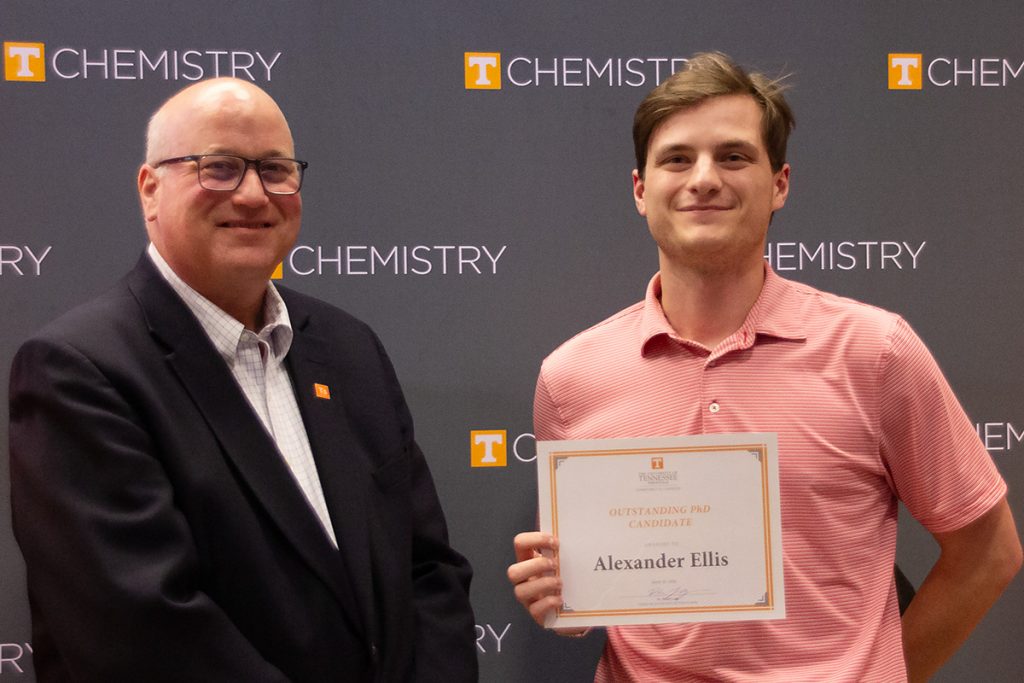 Alexander Ellis stands with Dr. Shaughnessy holding the certificate for his award.
